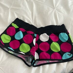 Roxy short board shorts. Juniors size 13.  Could fit a women’s size 6/8.